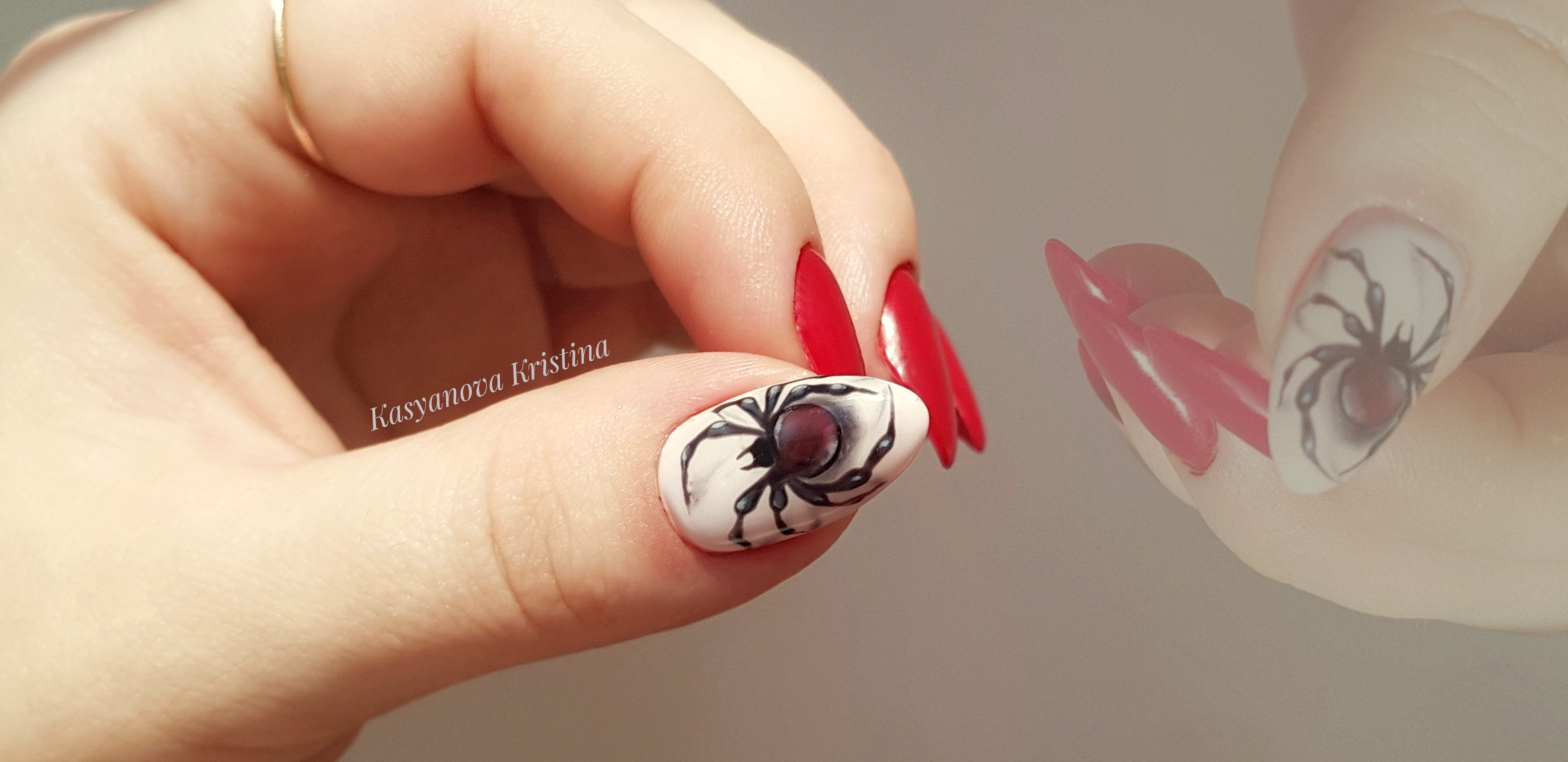 Маникюр в красном цвете с матовым рисунком "паук".